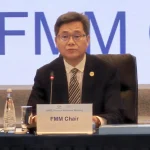 China finance official speaking at an APEC Finance Ministers Meeting