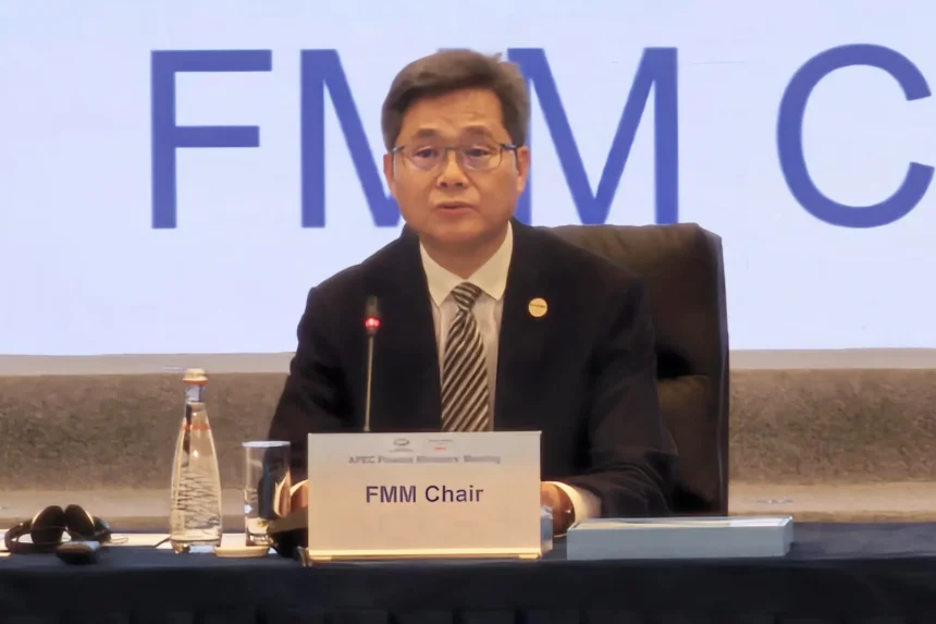 China finance official speaking at an APEC Finance Ministers Meeting