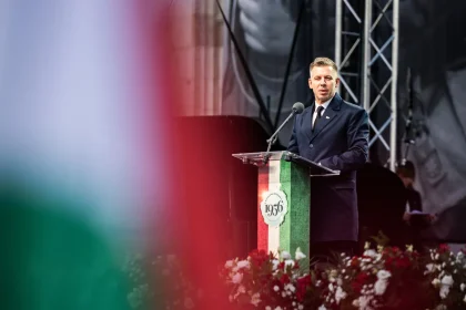 Hungarian Prime Minister Peter Magyar speaking at a 1956 uprising commemoration podium