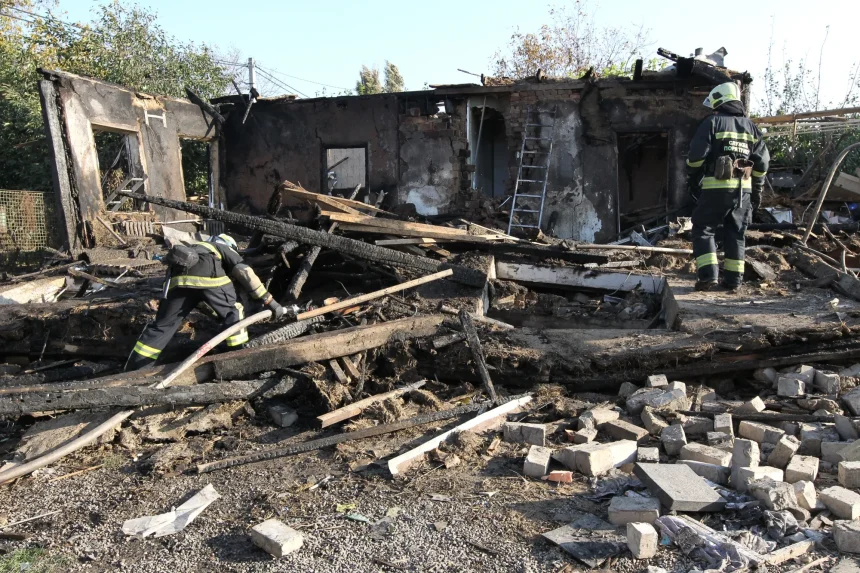 Firefighters working through the wreckage of a bombed building in Ukraine