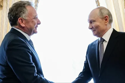 US envoy shakes hands with Russian President Vladimir Putin