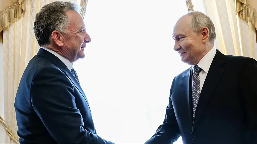 US envoy shakes hands with Russian President Vladimir Putin